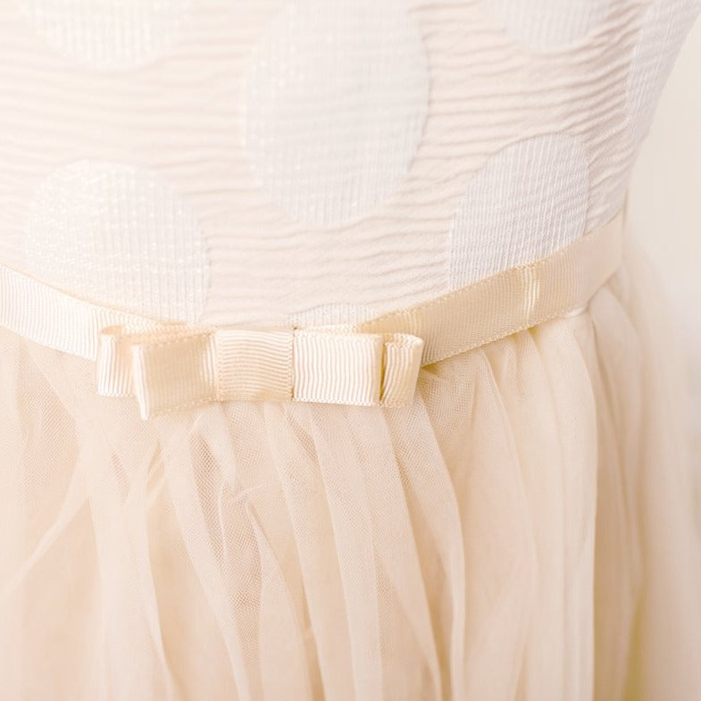 ky ky kids cream circle dress closeup of skirt